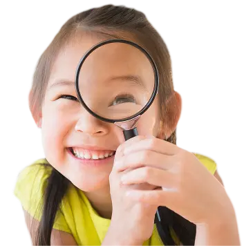 Girl looking through magnifying glass