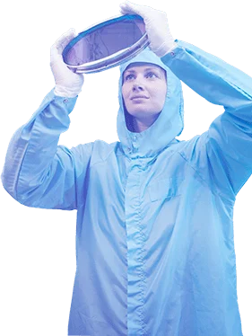 Scientist holding up glass circle